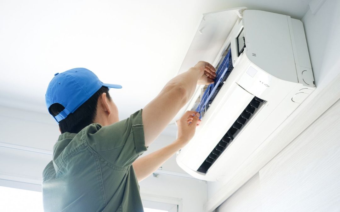 HVAC technician servicing a ductless mini split in San Clemente
