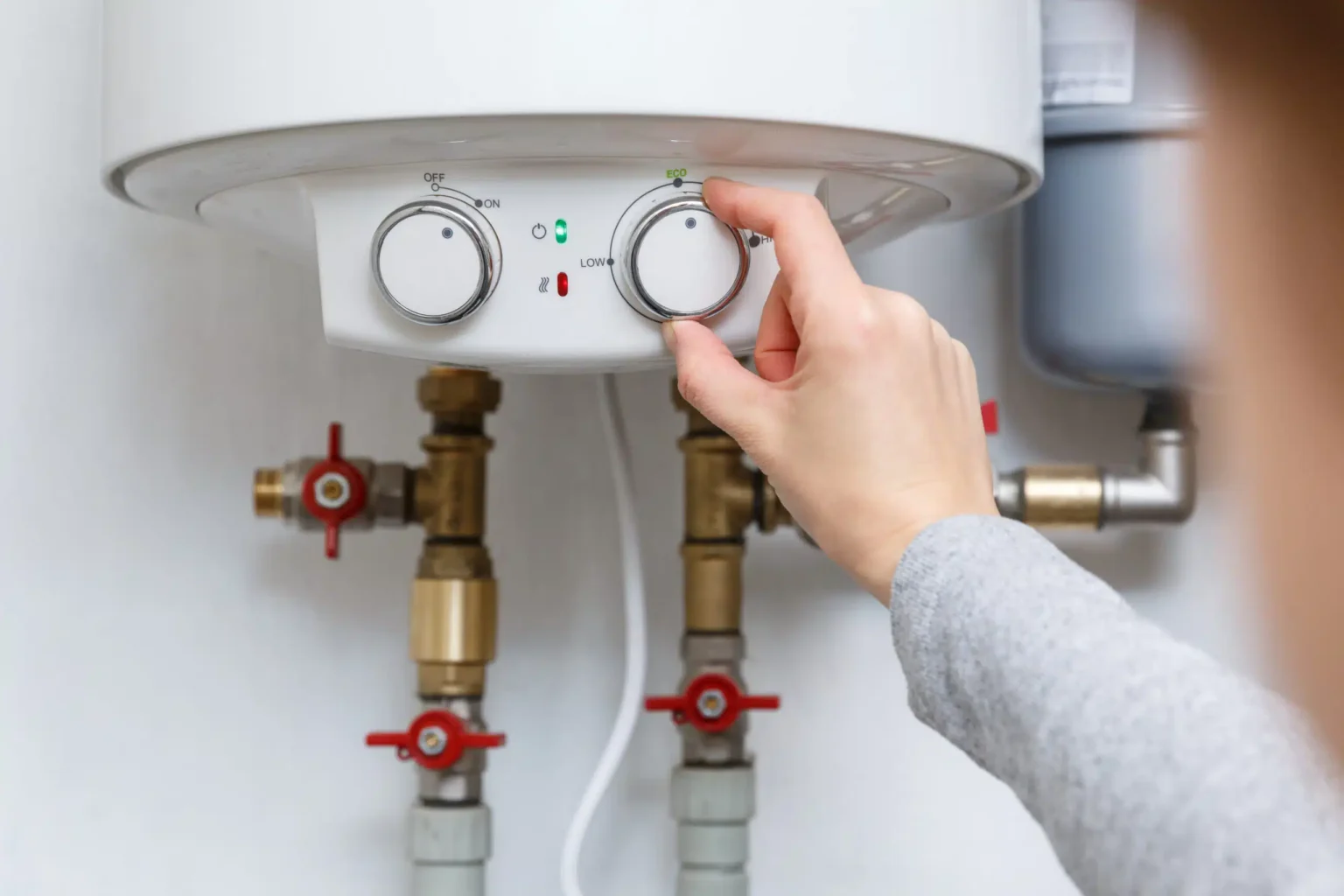 Technician adjusting a water heater in San Clemente